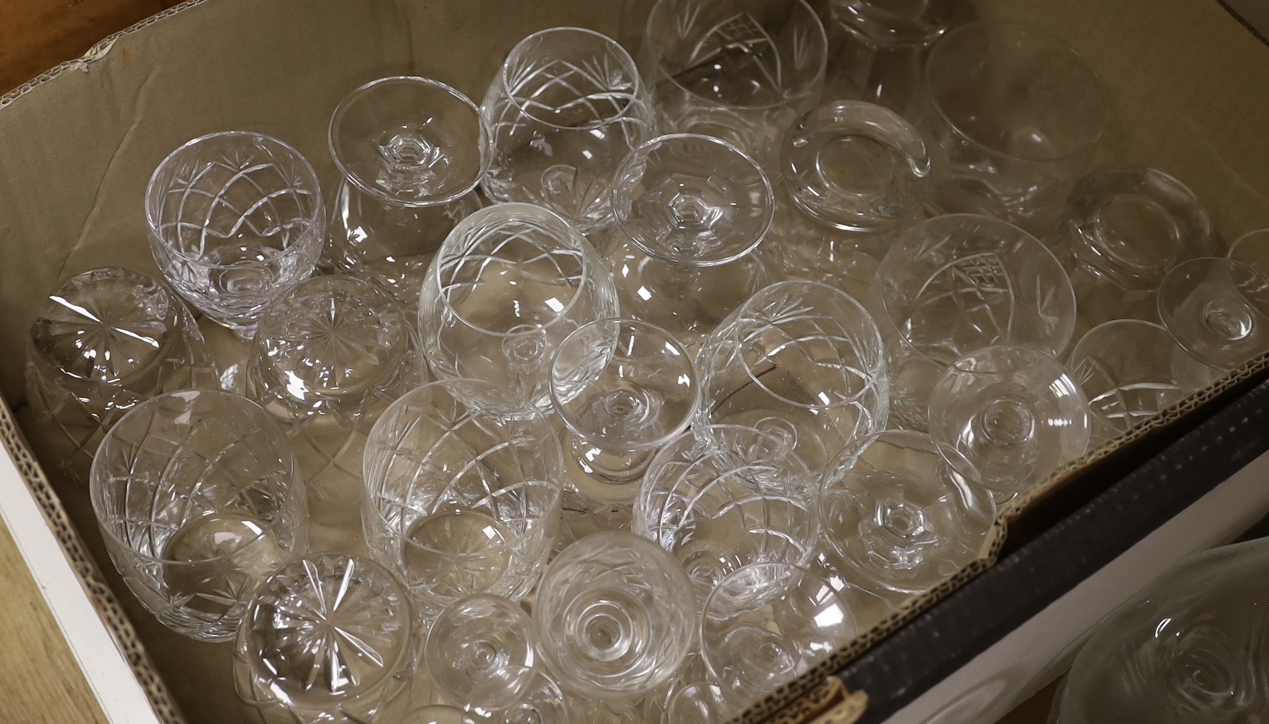 A quantity of mixed cut and moulded glass including beakers, bowls and a set of six fish shaped serving platters (approx 78)